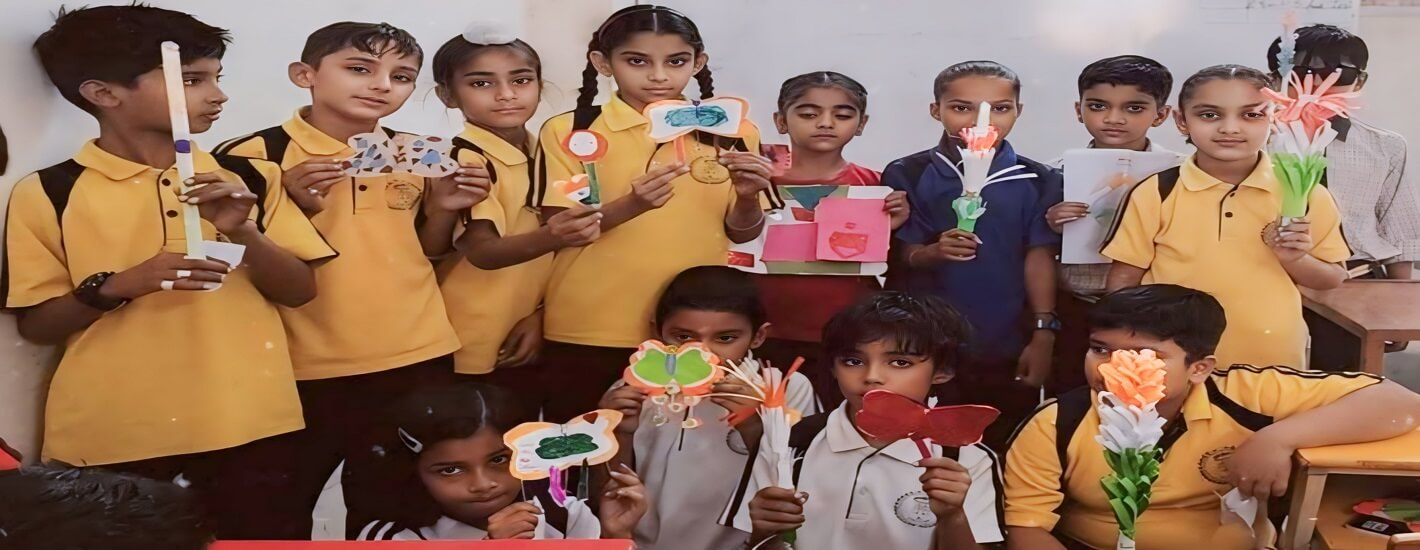 A group of children showcasing their colorful paper crafts.
